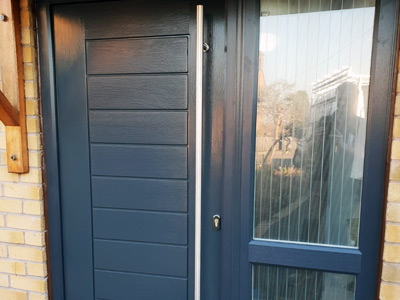 Installation of grey composite door and combination frame