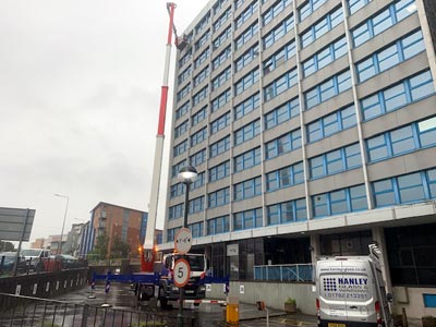 To replace broken double-glazed units high up with the use of a crane, as these were fitted from the exterior
