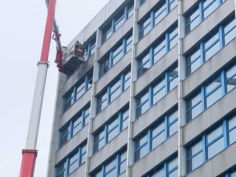 To replace broken double-glazed units high up with the use of a crane, as these were fitted from the exterior.