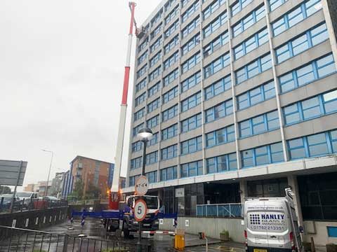 To replace broken double-glazed units high up with the use of a crane, as these were fitted from the exterior.