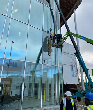 Safely replace damaged oversized double-glazed units at a Sixth Form College.