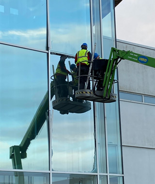 Safely replace damaged oversized double-glazed units at a Sixth Form College.