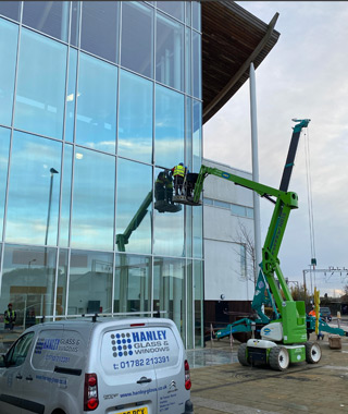Safely replace damaged oversized double-glazed units at a Sixth Form College.